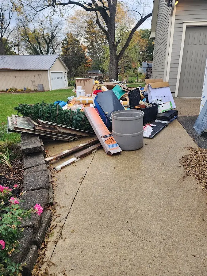 Dumpster being loaded with debris for 12 Yard Dumpster Rental in Westport